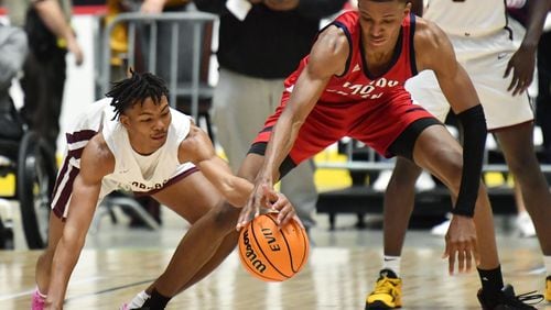 March 12, 2021 Macon - Cross Creek's Devin Pope (left) steals a ball from Sandy Creek's Jabari Smith (10) during the 2021 GHSA State Basketball Class AAA Boys Championship game at the Macon Centreplex in Macon on Friday, March 12, 2021 Cross Creek won 57-49 over Sandy Creek. (Hyosub Shin / Hyosub.Shin@ajc.com)