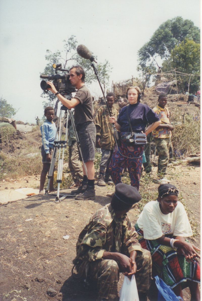 Elaine Widner (center) worked for CNN covering news events worldwide. Here, 
Widner was part of a team covering the Rwandan genocide in 1994.