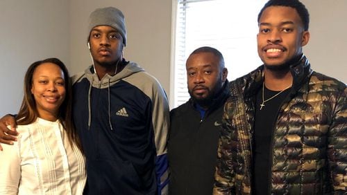 Christion Abercrombie, second from left, was able to leave the Shepherd Center over the weekend to visit his family at home.