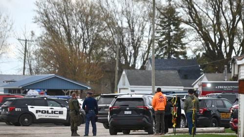 Authorities respond to the Swan Creek Boat Club after a driver crashed a vehicle through a building where a children's birthday party was taking place, Saturday, April 20, 2024, in Berlin Township, Mich. (Kathleen Kildee/Detroit News via AP)