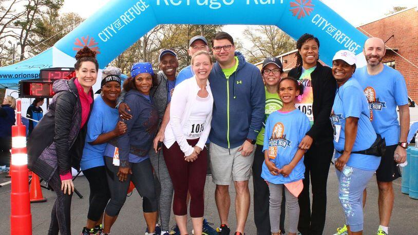 Members of Team Elavon pose for the cameras after the 2017 Refuge Run 5K and 10K hosted by City of Refuge. Proceeds from the run go toward helping pull people out of poverty. CONTRIBUTED BY TRUE SPEED PHOTOGRAPHY