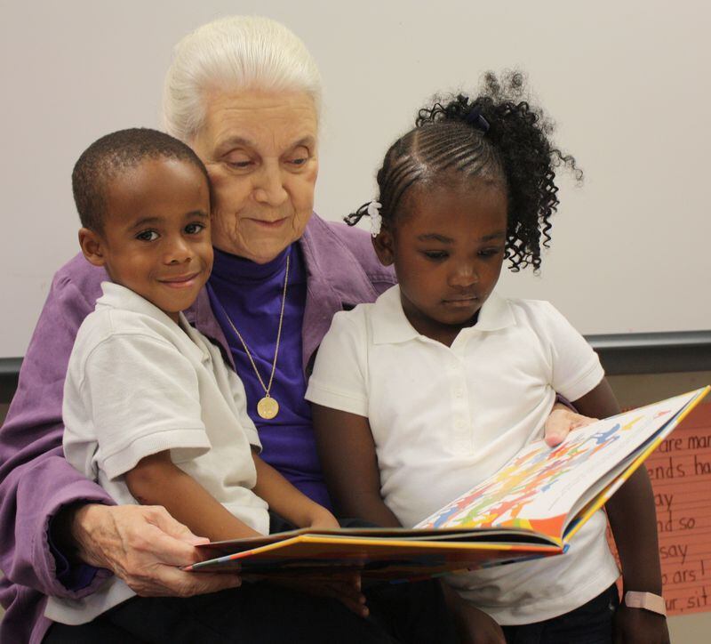 Kimmy Nicks reads with Atlanta Public School pre-K students.  Nicks founded Children's Book of Children's Literature 40 years ago to provide high-quality books for students, schools, libraries, and hospitals.  Courtesy of Children's Literature for Children