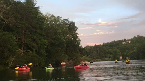 As the sun begins to set, paddlers head out on Tallulah Falls Lake for a 3-mile excursion that ends under the full moon. credit: Joell Zalatan