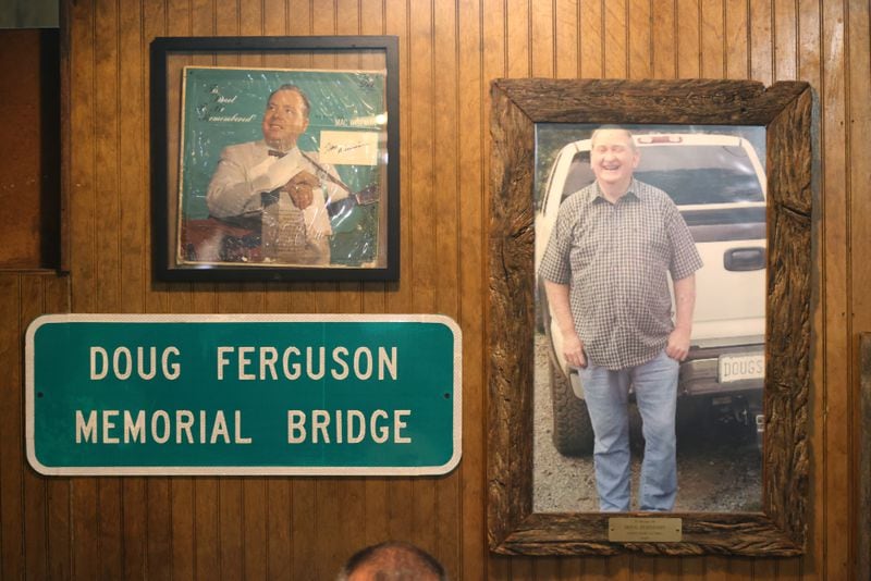 A photograph of Doug Ferguson is shown at Doug’s Place, a meat and three restaurant, on Old Allatoona Road, Thursday, November 3, 2022, in Emerson, Ga. Doug Ferguson is the founder of Doug’s Place. (Jason Getz / Jason.Getz@ajc.com)