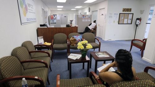 April 17, 2017 - Roswell - Clients wait in the lobby of one of the NFCC offices for help with medicaid applications. North Fulton Community Charities has seen a drop in legal immigrants seeking food stamps. These immigrants, who are eligible under the law to receive food stamps, are going so far as to drop out of the program when time comes for them to renew their benefits out of fear that signing up will be used to deport them or prevent them from becoming citizens. BOB ANDRES /BANDRES@AJC.COM