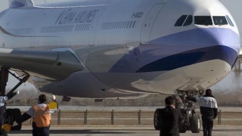 A China Airlines Airbus 330, similar to the one that made an emergency landing on Sunday, taxis on the runway at Beijing's Capital Airport in China. A China Eastern flight bound for Shanghai was forced to return to Sydney after a gaping hole opened in the plane’s engine well.