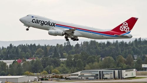A 747-8 Freighter takes off from Seattle-Tacoma International Airport headed to Luxembourg on its first revenue flight. (Jim Anderson/Boeing)