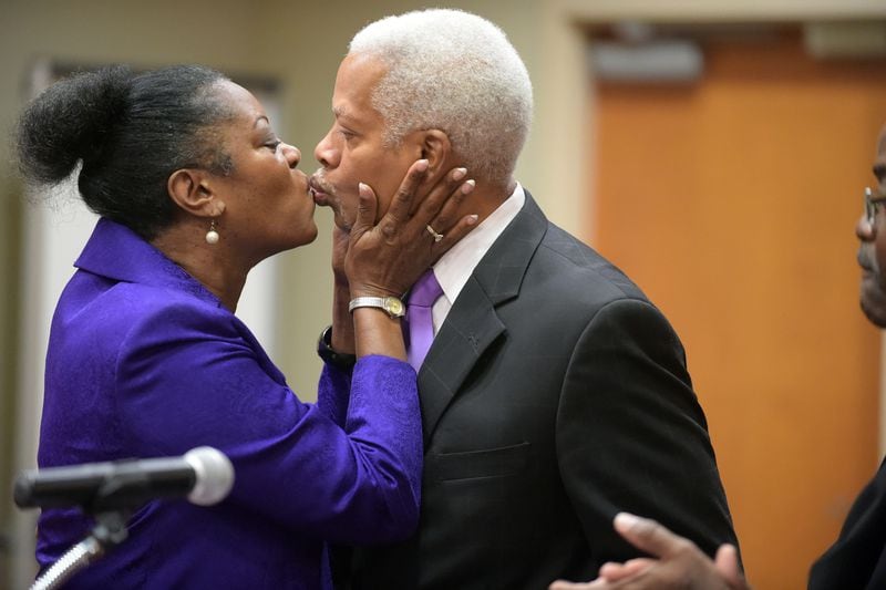 A KISS FOR THE COMMISSIONER=--JULY 20, 2015 DECATUR Incoming DeKalb Commissioner Mereda Davis Johnson kisses her husband, US Rep. Hank Johnson, after she was sworn in by DeKalb Superior Court Judge Gregory A. Adams, Monday, July 20, 2015. Her election brings the county commission to a full seven members for the first time in more than two years. KENT D. JOHNSON /KDJOHNSON@AJC.COM