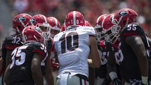 University of Georgia quarterback Jacob Eason (10) during a huddle during the G-Day game Saturday, April 22, 2017, in Athens.