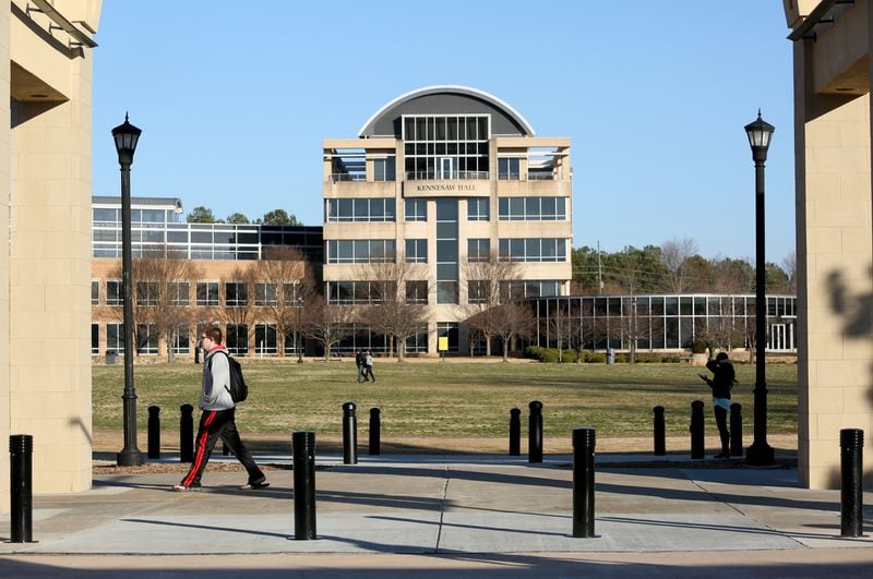 Kennesaw State University students walk on the KSU campus as Kennesaw Hall is shown in the background in this AJC file photo.