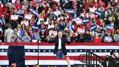 U.S. Sen. David Perdue speaks during the Republican National Committee's Victory Rally in Valdosta on Dec. 5, 2020. It’s a common theme: Politicians often seek the Lord’s career advice. And then they let folks know that they did. (Hyosub Shin / Hyosub.Shin@ajc.com)