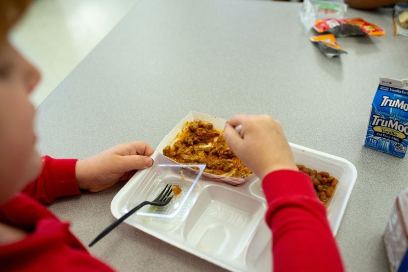 Students at Hickory Hills Elementary School in Marietta eat lunch. Many children in Georgia still cannot afford the standard lunch and either accrue meal debt or are fed an alternate meal. In Marietta, that meal is a cheese sandwich with milk or juice. REBECCA WRIGHT / FOR THE AJC