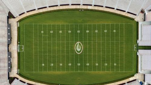 Aerial photo shows Sanford Stadium at the University of Georgia in Athens on Friday, June 11, 2021. With a $25 million expansion completed in 2003 and an additional $8 million in 2004, Sanford Stadium added a second upper deck on the north side and 27 new north side SkySuites bringing the new stadium capacity to 92,746 - the fifth largest on-campus stadium in the country. (Hyosub Shin / Hyosub.Shin@ajc.com)