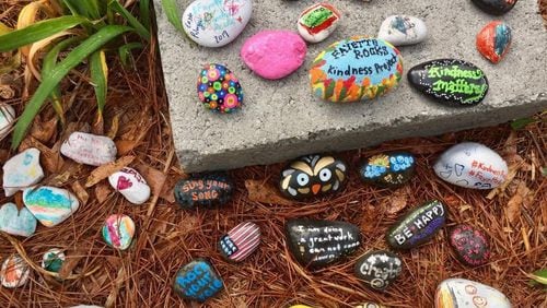 Gardens of painted rocks with inspirational messages are popping up throughout Fayette County. Visitors are encouraged to take a rock and/or leave one for others. Jill Howard Church for the AJC