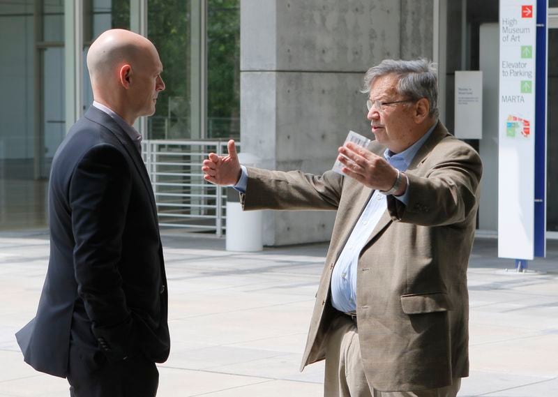 Bill Arnett (right) talks with High Museum director Rand Suffolk at the High in May. (Bob Andres / bandres@ajc.com)