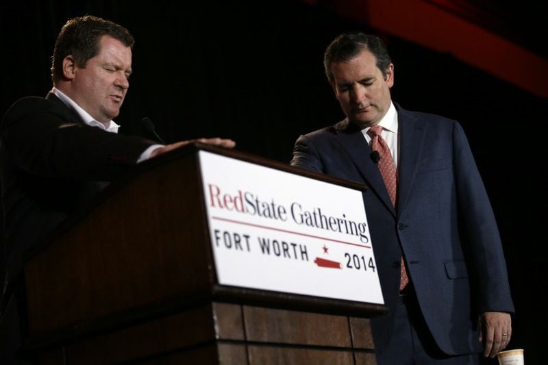 Erick Erickson, left, and Ted Cruz pray at the 2014 RedState gathering. AP photo