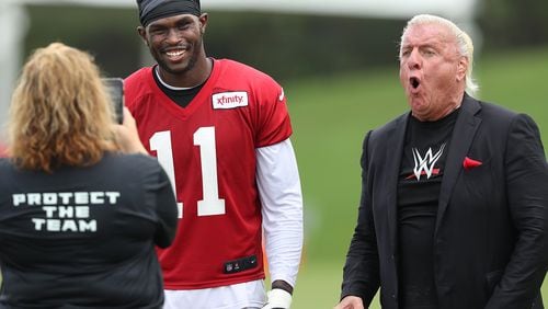 080916 FLOWERY BRANCH: Ric Flair, former professional wrestler, hangs out with Falcons wide receiver Julio Jones during team practice at training camp on Tuesday, August 9, 2016, in Flowery Branch.   Curtis Compton /ccompton@ajc.com