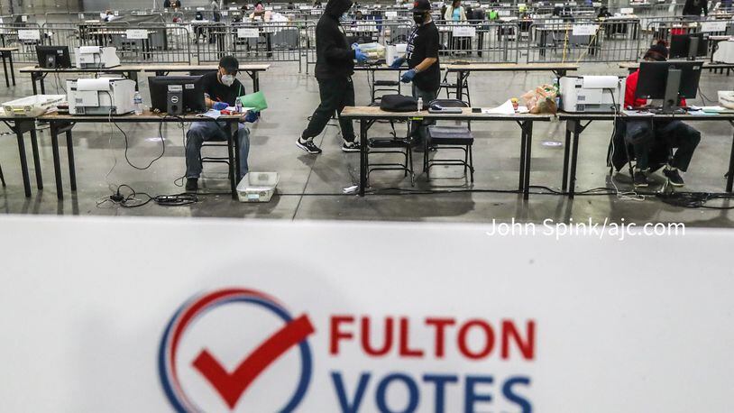 Fulton County elections workers open and sort ballots at the Georgia World Congress Center in Atlanta on Jan. 5, 2021.