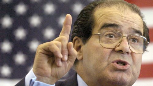 FILE - In this Wednesday, April 7, 2004 file photo, U.S. Supreme Court Justice Antonin Scalia speaks to Presbyterian Christian High School students in Hattiesburg, Miss. On Saturday, Feb. 13, 2016, the U.S. Marshall's Service confirmed that Scalia has died at the age of 79. (Gavin Averill/The Hattiesburg American via AP)