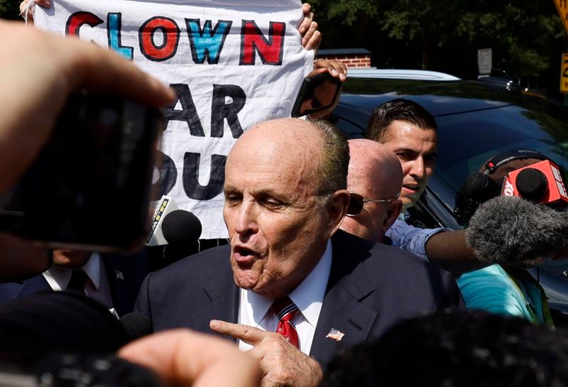 Former New York City mayor Rudy Giuliani speaks to press members outside the Fulton County Jail after being booked on Wednesday, August 23, 2023. (Miguel Martinez / miguel.martinezjimenez@ajc.com)