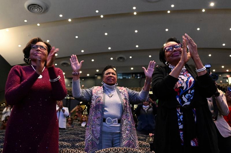 Parishioners clap and raise their hands as Rev. Gina Stewart preaches during church service at Rankin Chapel, Sunday, April 7, 2024, in Washington. Throughout its long history, the Black Church in America has, for the most part, been a patriarchal institution. Now, more Black women are taking on high-profile leadership roles. But the founder of Women of Color in Ministry estimates that less than one in 10 Black Protestant congregations are led by a woman. “I would hope that we can knock down some of those barriers so that their journey would be just a little bit easier,” said Stewart. (AP Photo/Terrance Williams)