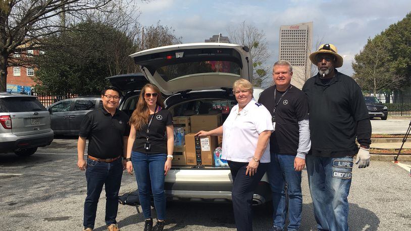 Members from Mercedes-Benz USA and The Salvation Army unload 500 emergency kits at The Salvation Army Metro Atlanta Red Shield Shelter. Pictured (L-R): Benjamin Zhang, Kat Reynolds, Janeane Schmidt, Michael Swearingen, Michael Davidson. Courtesy Mercedes Benz-USA