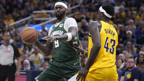 Milwaukee Bucks' Bobby Portis (9) goes to the basket against Indiana Pacers' Pascal Siakam (43) during the first half of Game 4 of the first round NBA playoff basketball series, Sunday, April 28, 2024, in Indianapolis. (AP Photo/Michael Conroy)