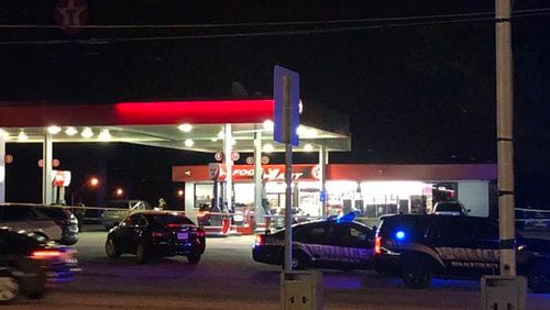 Investigators said two men were involved in a verbal dispute at the gas station, and one of them shot the other.