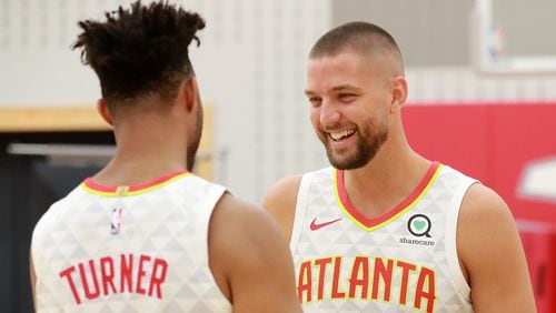 Atlanta Hawks guard Evan Turner (left) and forward Chandler Parsons share a laugh during media day on Monday, Sept. 30, 2019, in Atlanta.    Curtis Compton/ccompton@ajc.com