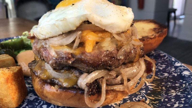The burger at Botica adds a bit of Spanish flair by adding Salchichón, a Spanish summer sausage, and topped with egg plancha. 
Courtesy of Botica