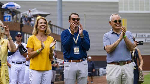 Georgia Tech athletic director J Batt is flanked by Tech president Angel Cabrera, right, and his wife, Beth Cabrera, as they watch the ceremony honoring Tech baseball great Mark Teixeira. Tech retired Teixeira's jersey No. 23 before the Yellow Jackets played Virginia on Saturday, May 20, 2023 at Russ Chandler Stadium. (Photo by Eldon Lindsay/Georgia Tech Athletics)