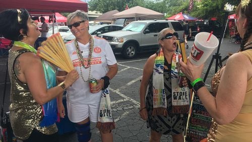 Atlanta United fans (L-R) Terri Harrington, Fran Tabor, Lori Peterson and Angel Whitworth meet during the All Stripes tailgate June 29, 2019 at Mercedes-Benz Stadium, on the 50th anniversary of the Stonewall riots in New York. All Stripes is an Atlanta United supporter group for LGBTQ fans and their allies.