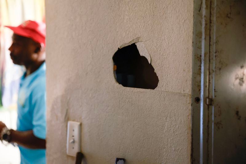 A hole had been punched into the wall of a Woodland Heights apartment that underwent inspection in July by the city of Atlanta’s Safe and Secure Housing program. The northwest Atlanta complex had been awarded $72 million in city, state and federal subsidies since 2017 for renovations. (Natrice Miller/natrice.miller@ajc.com)