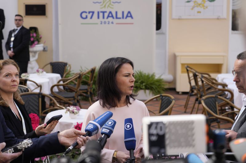 German Foreign Minister Annalena Baerbock talks to reporters during the G7 Foreign Ministers meeting on Capri Island, Italy, Thursday, April 18, 2024. (AP Photo/Gregorio Borgia)