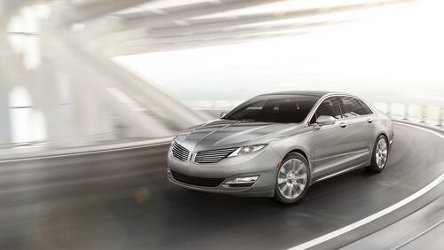 The 2014 Lincoln MKZ is available as a conventional four-cylinder sedan or as a hybrid for the same base price. (MCT)