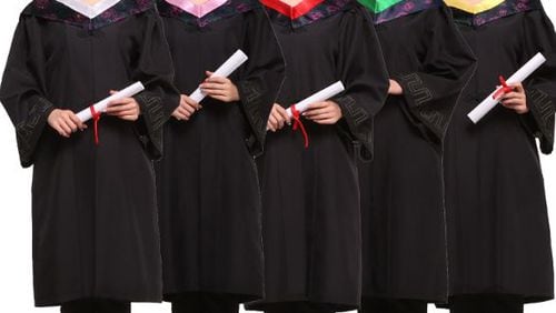 A high school in Paulding County told girls they had to wear dresses under their graduation robes, leading to complaints and now a policy change, Even advertisements for graduation gowns feature female models in pants .