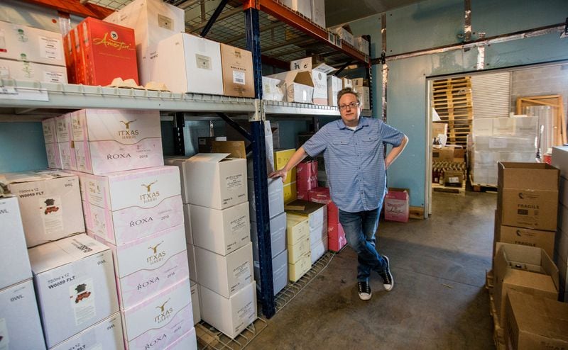 James Murphy, general manager at Avant Partir, a high-end wine distributor in Duluth, is making hard decisions to postpone and cancel orders in recent weeks due to the coronavirus outbreak. The business was working to keep all employees on the payroll in late March but was cutting back and taking turns in the warehouse. “This is a labor of love,” Murphy said. “We want to take care of our team.” (Jenni Girtman for The Atlanta Journal Constitution)