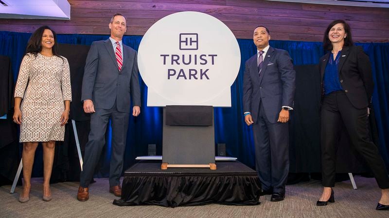 Truist chief of marketing officer Susan Johnson (left), Atlanta Braves CEO and president Derek Schiller (second from left), Truist chief digital and client experience officer Donta Wilson (second from right) and Truist Northern Georgia region president Jenna Kelly (right) unveil the new name for SunTrust Park as Truist Park during a press conference Tuesday, Jan. 14, 2020, at the stadium in Atlanta.