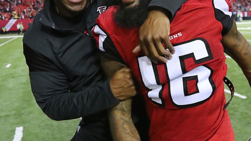 *** POSSIBLE VISUAL LEDE *** January 14, 2017, Atlanta: Falcons wide recievers coach Raheem Morris and wide receiver Justin Hardy celebrate a 36-20 victory over the Seahawks in a NFL football NFC divisional playoff game on Saturday, Jan. 14, 2017, in Atlanta. Curtis Compton/ccompton@ajc.com