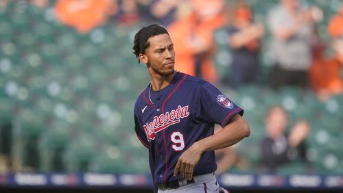 Minnesota Twins' Andrelton Simmons walks back to the dugout after striking out to end the tenth inning of a baseball game against the Detroit Tigers, Tuesday, April 6, 2021, in Detroit. (AP Photo/Carlos Osorio)