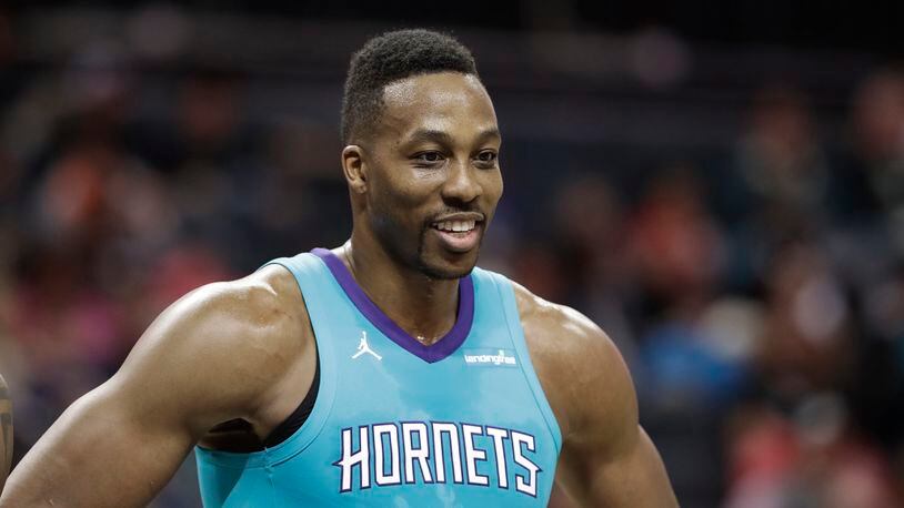 Charlotte Hornets' Dwight Howard smiles during a stop in play during the second half of an NBA basketball game against the Brooklyn Nets in Charlotte, N.C., Thursday, March 8, 2018. (AP Photo/Chuck Burton)