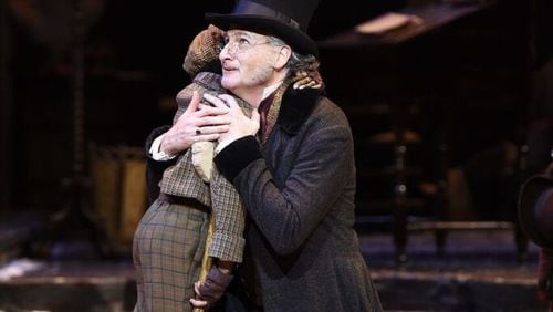 Actor David de Vries (Ebenezer Scrooge) and Jaden Robinson as Tiny Tim. De Vries said Jaden is a real joy to work with. He said Jaden is always open to thinking about the role in different ways. CONTRIBUTED BY GREG MOONEY / ALLIANCE THEATRE