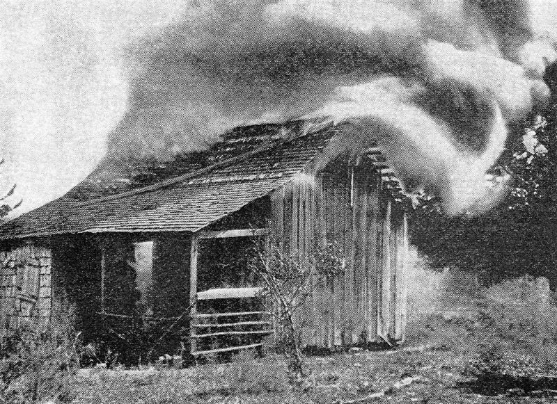 The house of a black resident of Rosewood goes up in flames during a massacre by a white mob in 1923. (Florida Memory)