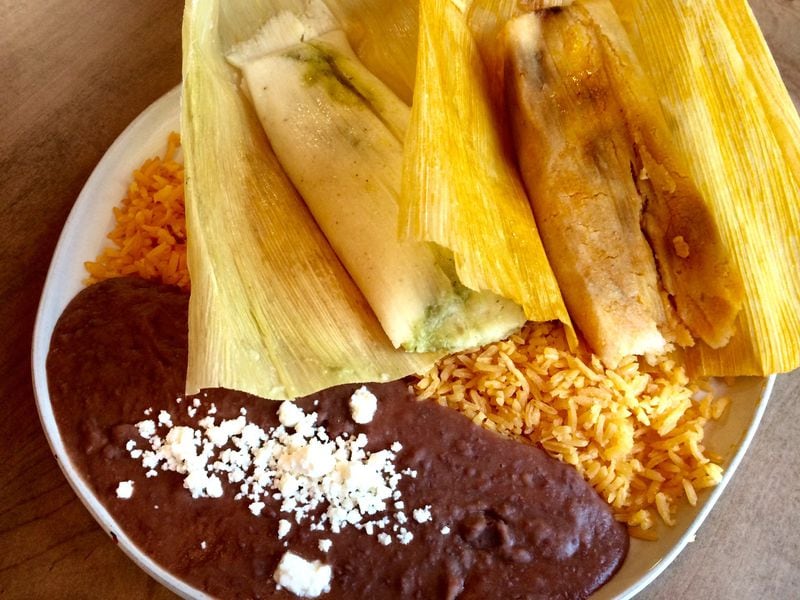 La Mixteca’s tamale lunch special comes with choice of two hand-crafted tamales (such as these green chile pork and chicken mole versions), refried beans and rice. CONTRIBUTED BY WENDELL BROCK