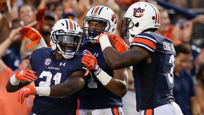 Auburn running back Kerryon Johnson (left) has delivered three straight huge performances for the Tigers leading up to Saturday's game at LSU.