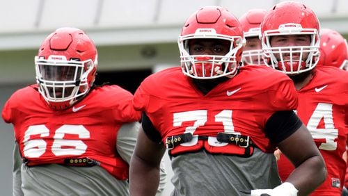 Guard Solomon Kindley (6-4, 330 pounds), tackle Andrew Thomas (6-5, 320) and guard Ben Cleveland (6-6, 340) are three of Georgia's massive offensive linemen.