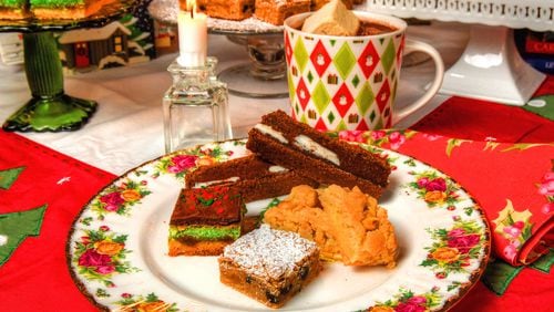 Christmas is the perfect time for cookies, like this selection (clockwise starting at bottom of the plate): California fruit bars, Viennese marzipan bars, Palm Beach brownies and brittle peanut bars. Chris Hunt for The AJC