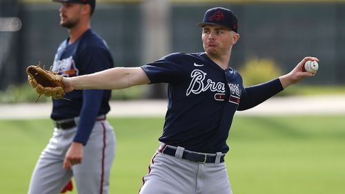 031622 North Port: Atlanta Braves pitchers Sean Newcomb (right) and Kyle Muller loosen up their arms during Spring Training at CoolToday Park on Wednesday, March 16, 2022, in North Port.    “Curtis Compton / Curtis.Compton@ajc.com”