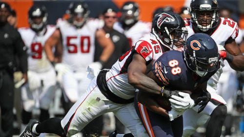 Dion Sims of the Bears is tackled by Falcons linebacker Deion Jones during the season-opening game Sunday at Chicago's Soldier Field.