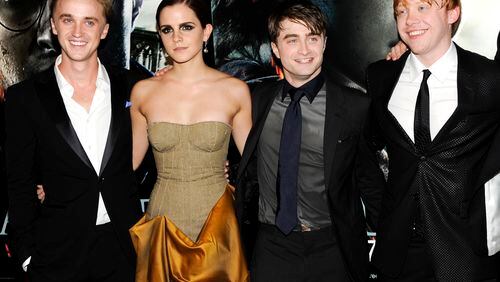 FILE - In this July 11, 2011 file photo, cast members, from left, Tom Felton, Emma Watson, Daniel Radcliffe and Rupert Grint pose together at the premiere of "Harry Potter and the Deathly Hallows: Part 2" at Avery Fisher Hall in New York. Warner Bros. said on Oct. 3, 2016, that all 8 Harry Potter films will be re-released in theaters for a one-week run beginning Oct. 13, 2016. (AP Photo/Evan Agostini, File)